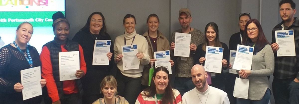 A group of newly qualified social workers receiving their certificates for completing ASYE programme