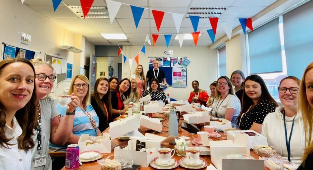 Tea, cake and bunting! Liam's colleagues celebrating their achievements with an afternoon tea. 